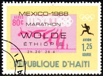[Airmail - Winners of Olympic Marathon showing Commemorative Inscription and Stamp of "Host" Country, tip LJ]