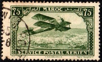 [Airmail - Plane over Casablanca - Inscribed MAROC above, POSTAL SERVICE AERIEN below, type AF]