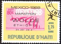 [Airmail - Winners of Olympic Marathon showing Commemorative Inscription and Stamp of "Host" Country, tip LJ]