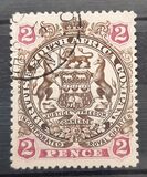 [Coat of Arms - End of Scroll Curled between Legs of Supporting Animals, type J2]